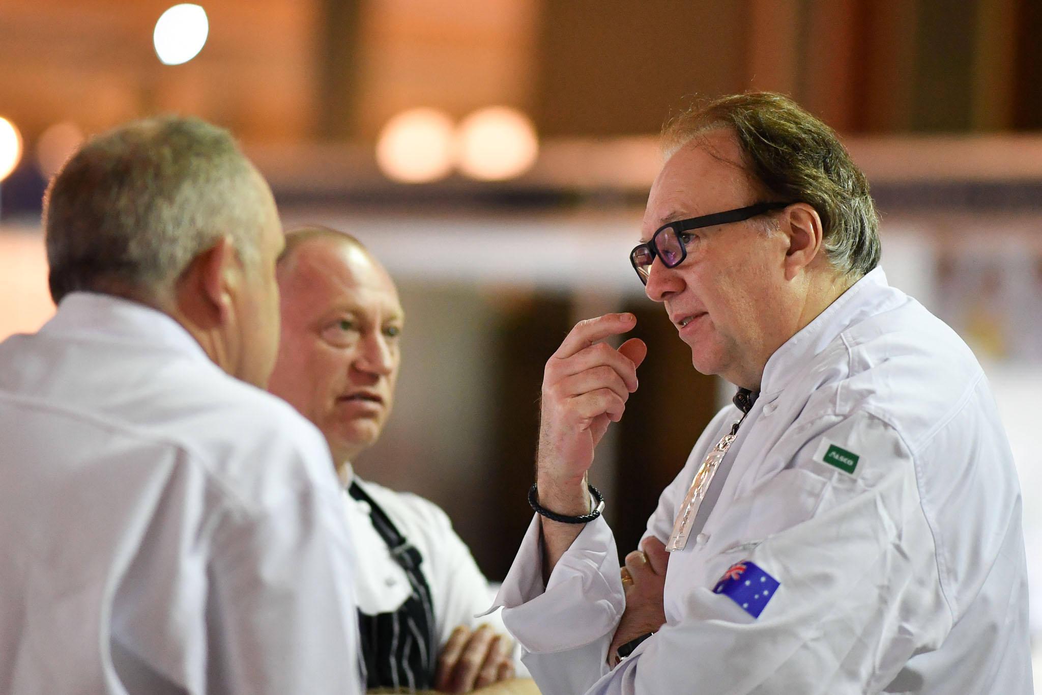 Melbourne, 30 May 2017 - Head judge Philippe Mouchel from the Philippe Restaurant kitchen invigilator judge talks to Tom Milligan of the Bocuse d'Or Academy Australia at the Australian selection trials of the Bocuse d'Or culinary competition held during the Food Service Australia show at the Royal Exhibition Building in Melbourne, Australia. Photo Sydney Low