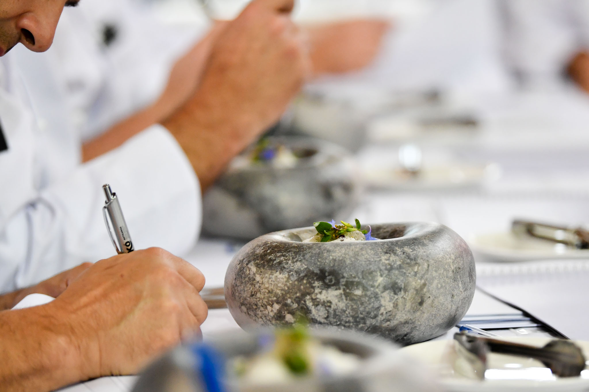 Melbourne, 30 May 2017 - The judges prepare to taste the fish dish of Michael Cole of the Georgie Bass Café & Cookery in Flinders at the Australian selection trials of the Bocuse d'Or culinary competition held during the Food Service Australia show at the Royal Exhibition Building in Melbourne, Australia. Photo Sydney Low