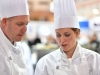 Melbourne, 30 May 2017 - Michael Cole and commis chef Laura Skvor of the Georgie Bass Café & Cookery in Flinders in discussions at the Australian selection trials of the Bocuse d'Or culinary competition held during the Food Service Australia show at the Royal Exhibition Building in Melbourne, Australia. Photo Sydney Low